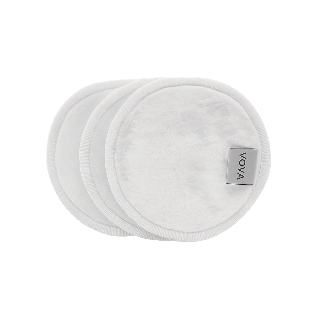Three white VOYA Bamboo pads with the VOYA brand label