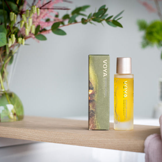 Voya skincare product on a wooden shelf with a blurred background