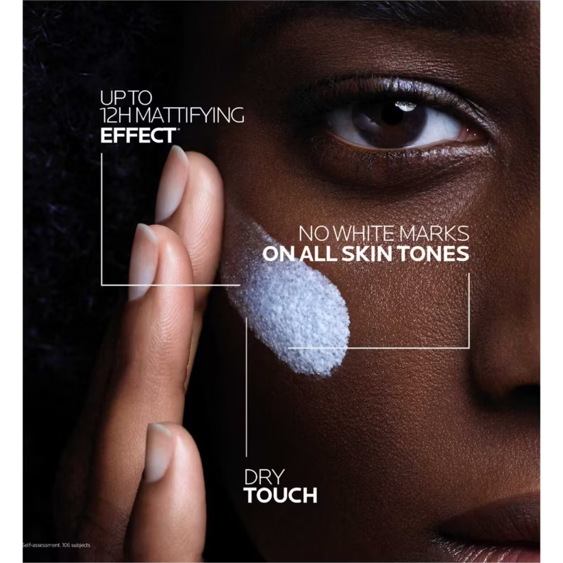 La Roche Posay Anthelios UVMune Oil Control fluid spf50+ 50ml being applied with text showing Mattifying effect, no white marks on all skin tones and dry touch