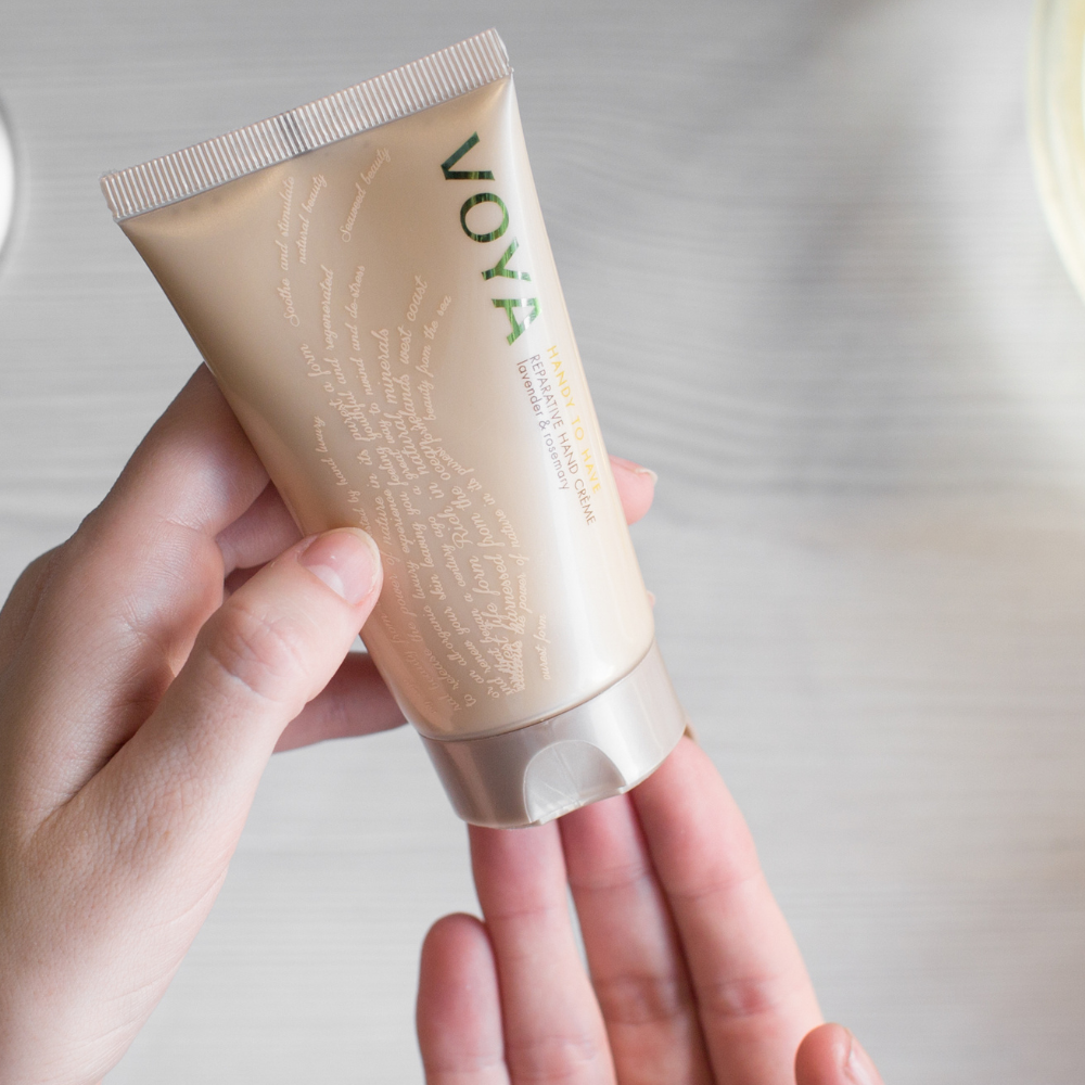 Voya hand cream with a blurred background