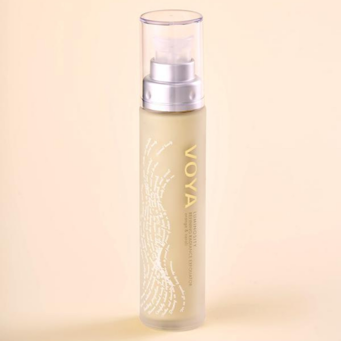 VOYA Luminosity Refining Radiance Exfoliator in glass bottle with pump and clear plastic lid