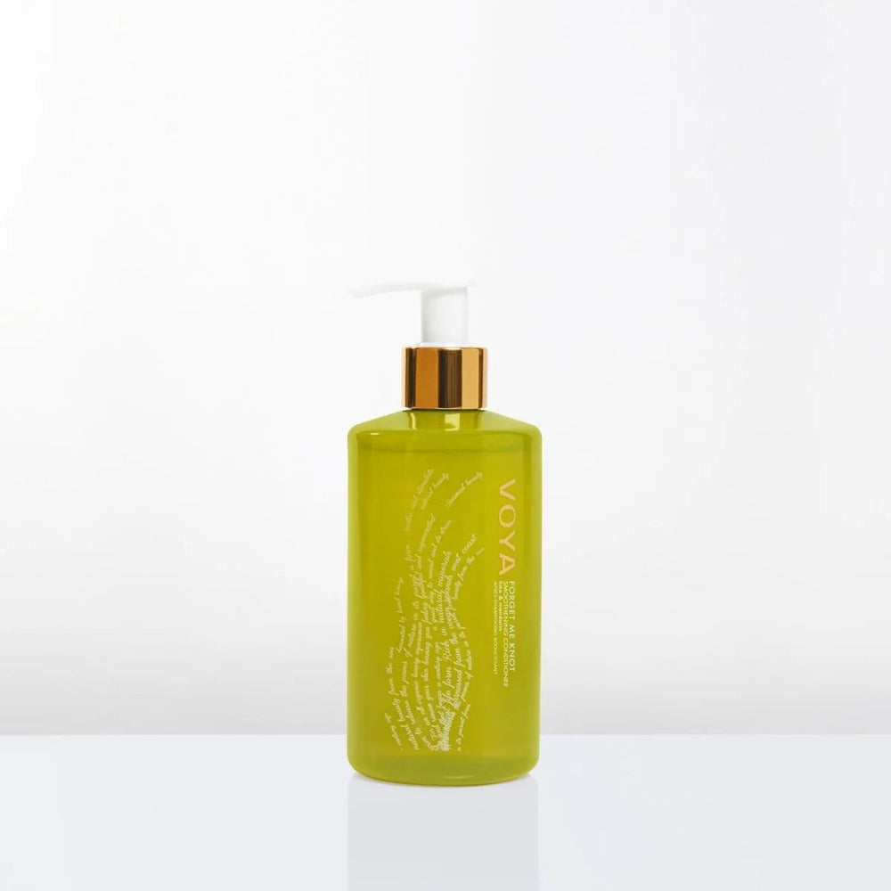 Voya Conditioner with gold cap on a white background