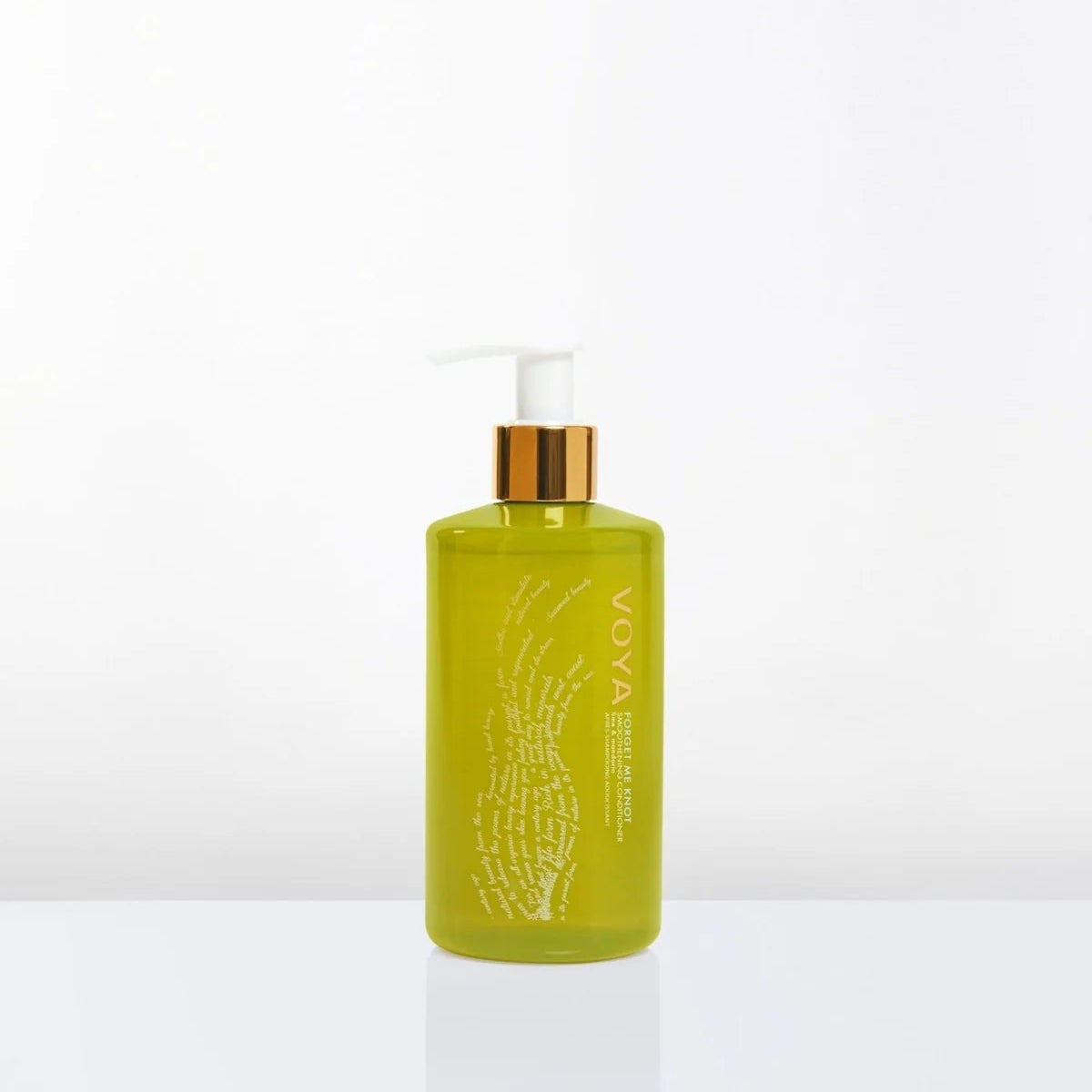 Voya Conditioner with gold cap on a white background
