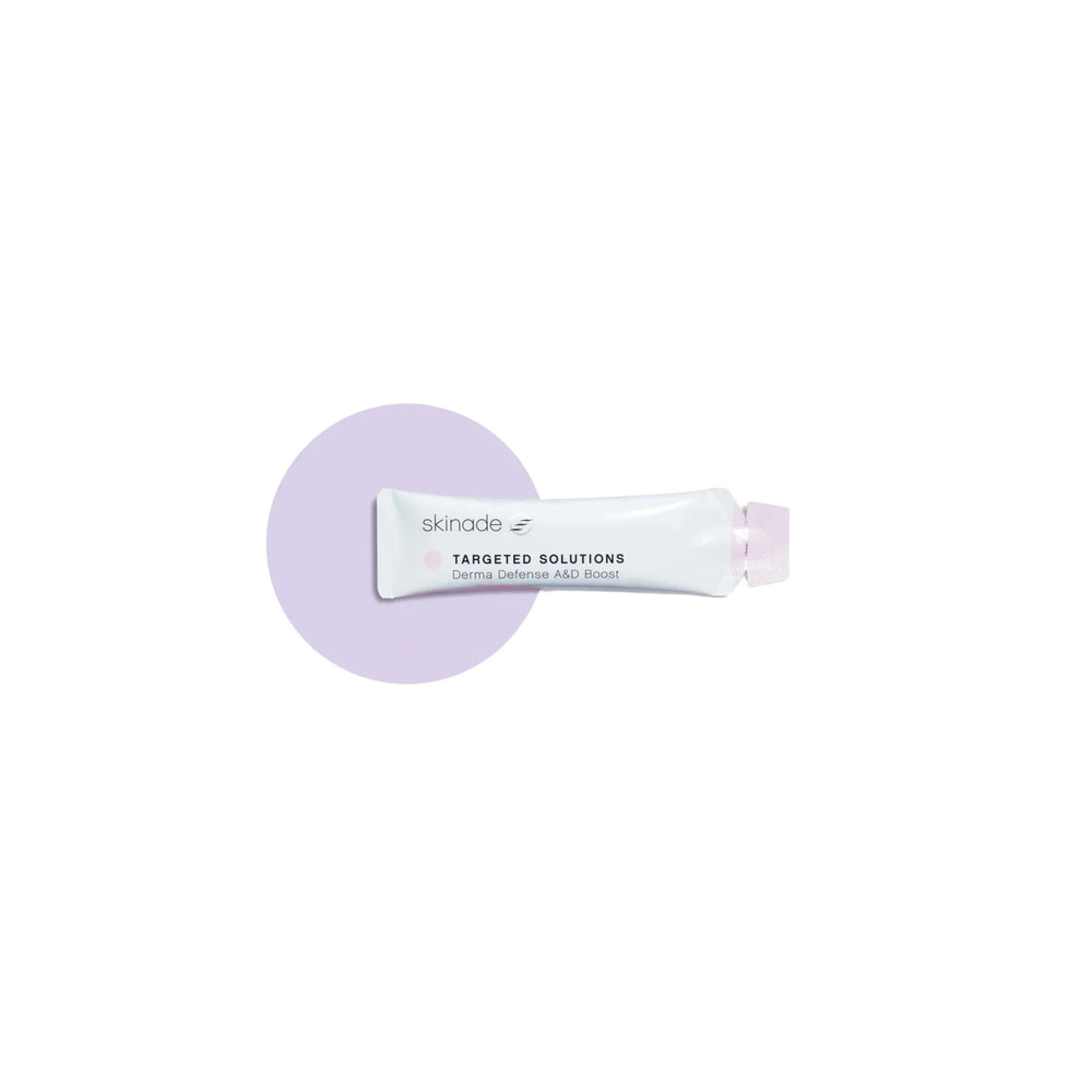 A sachet of Skinade Targeted Solutions A&D, with a purple and white color scheme, indicating it is a 3000IU dose of both Vitamin A and Vitamin D, natural mango and coconut flavor.