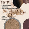 Trystal loose mineral powder with a brush and product container on a beige background