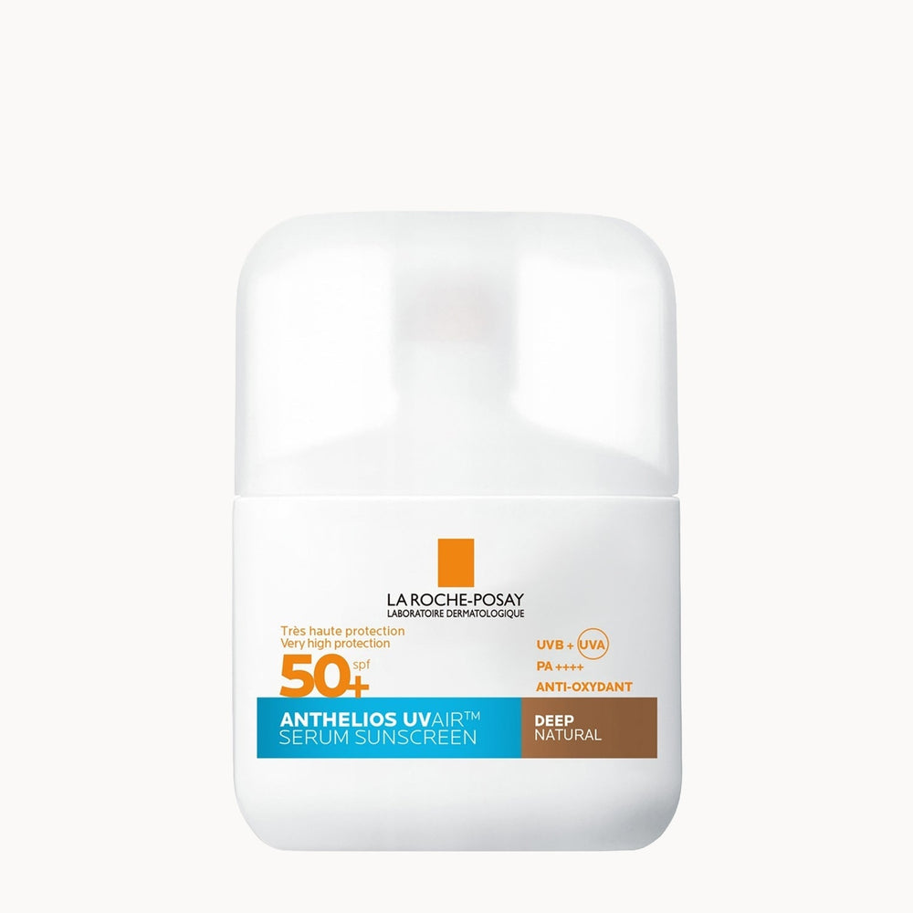 La Roche-Posay Anthelios UV+AIR Serum Sunscreen SPF 50+ in a white cylindrical bottle with a white cap, featuring orange, blue, and brown label accents on a light gray background.
