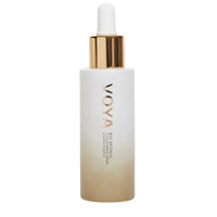 A clear glass bottle with a dropper containing the VOYA Bio Retinol Concentrate Serum, with a white label and gold accents on the bottle.