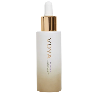 A clear glass bottle with a dropper containing the VOYA Bio Retinol Concentrate Serum, with a white label and gold accents on the bottle.