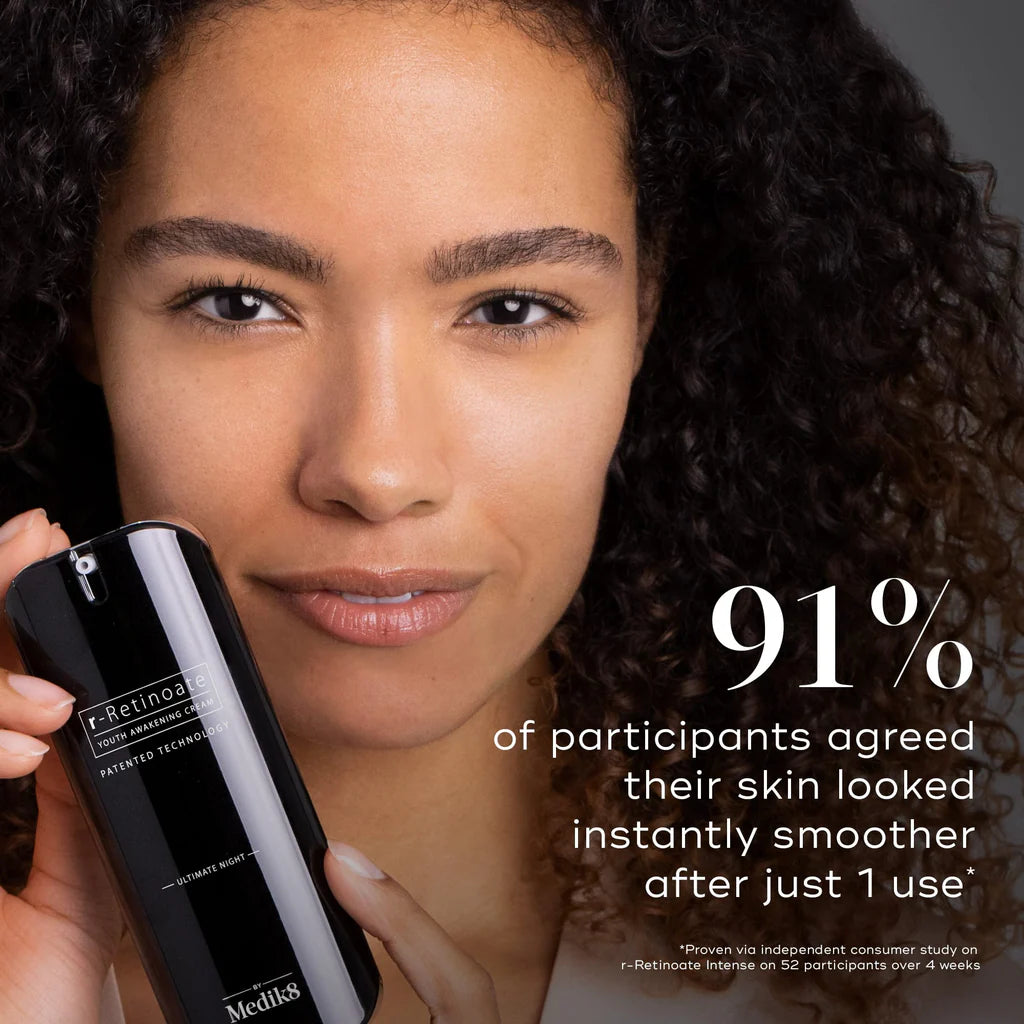 Woman holding a skincare product with text about skin smoothing effects