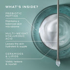 Skincare product with dropper and text detailing ingredients on a teal background