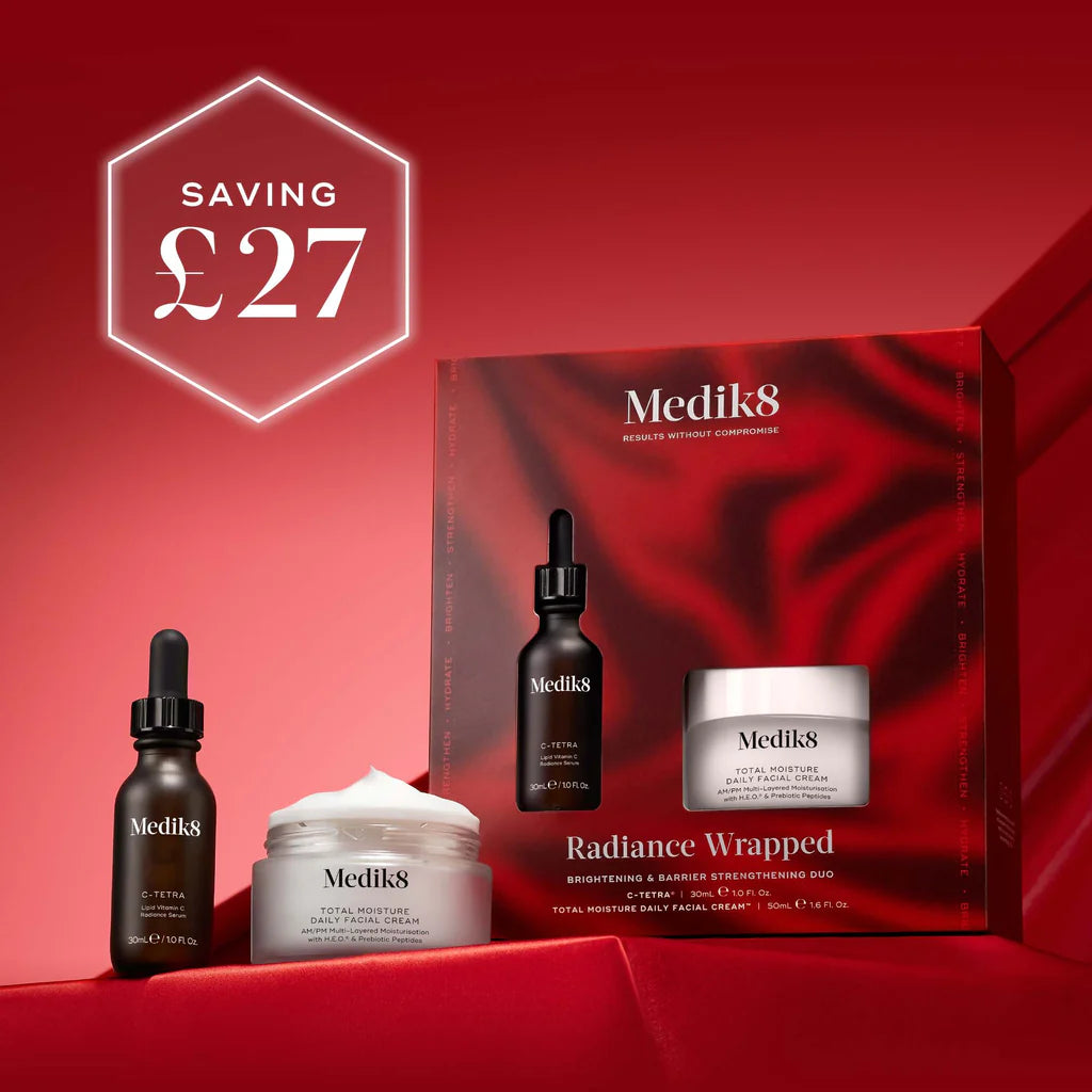 Medik8 Radiance Wrapped skincare products with a box on a red background, featuring a saving of £27.