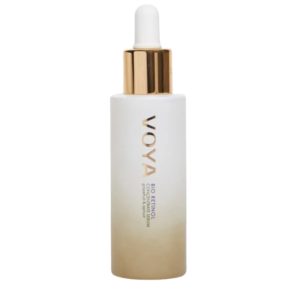 A clear glass bottle with a dropper containing the VOYA Bio Retinol Concentrate Serum, with a white label and gold accents on the bottle.