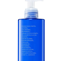 Blue bottle with a pump on a white background
