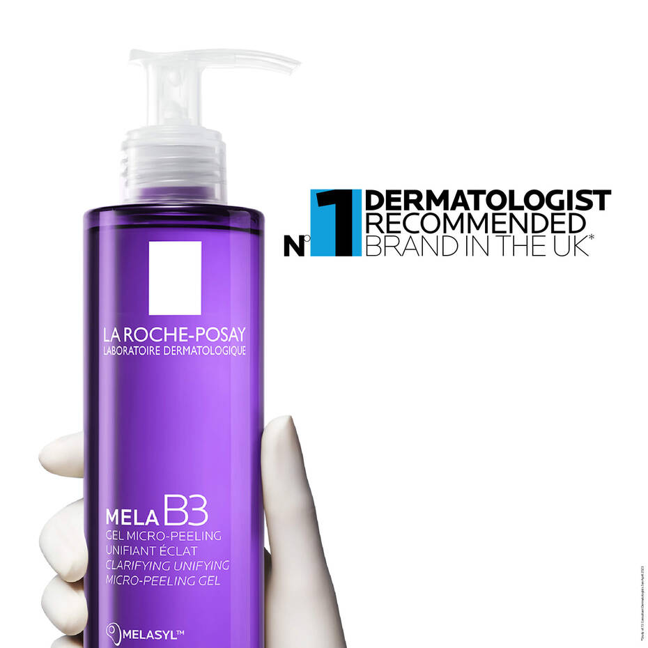 Purple bottle of La Roche-Posay Mela B3 gel with a hand holding it, on a white background.
