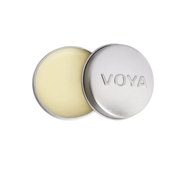 A round tin container of VOYA Lemon & Lime Organic Lip Balm, lid off, showing the balm inside.