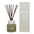 A VOYA reed diffuser with cedar and bergamot scent, consisting of a glass bottle, decorative cap and a bundle of reed sticks.