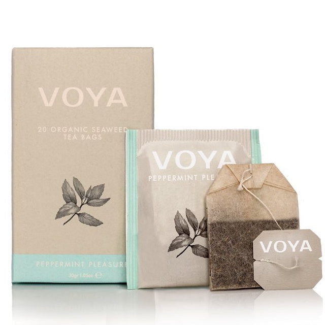 Voya tea packaging with boxes and a tea bag on a white background