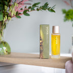 Voya skincare product on a wooden shelf with a blurred background