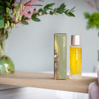 Voya skincare product on a wooden shelf with a blurred background