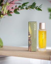 Voya skincare product on a wooden shelf with a blurred background
