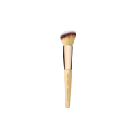 A beige contouring and blending brush with a large, angled top and a branded handle.