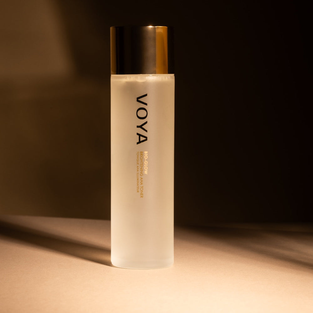 Voya Bio Glow skincare bottle on a dark background