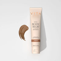 Vita Body Blur tube with a swatch on a light gray background