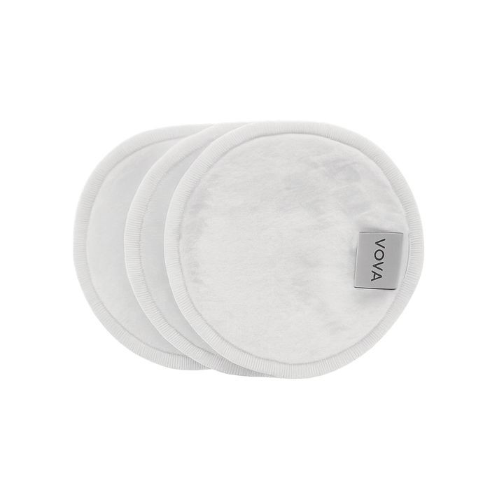Three white VOYA Bamboo pads with the VOYA brand label