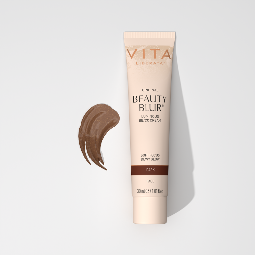 A tube of Vita Liberata Original Beauty Blur Luminous BB/CC Cream in dark shade with a swatch of the cream color next to it.
