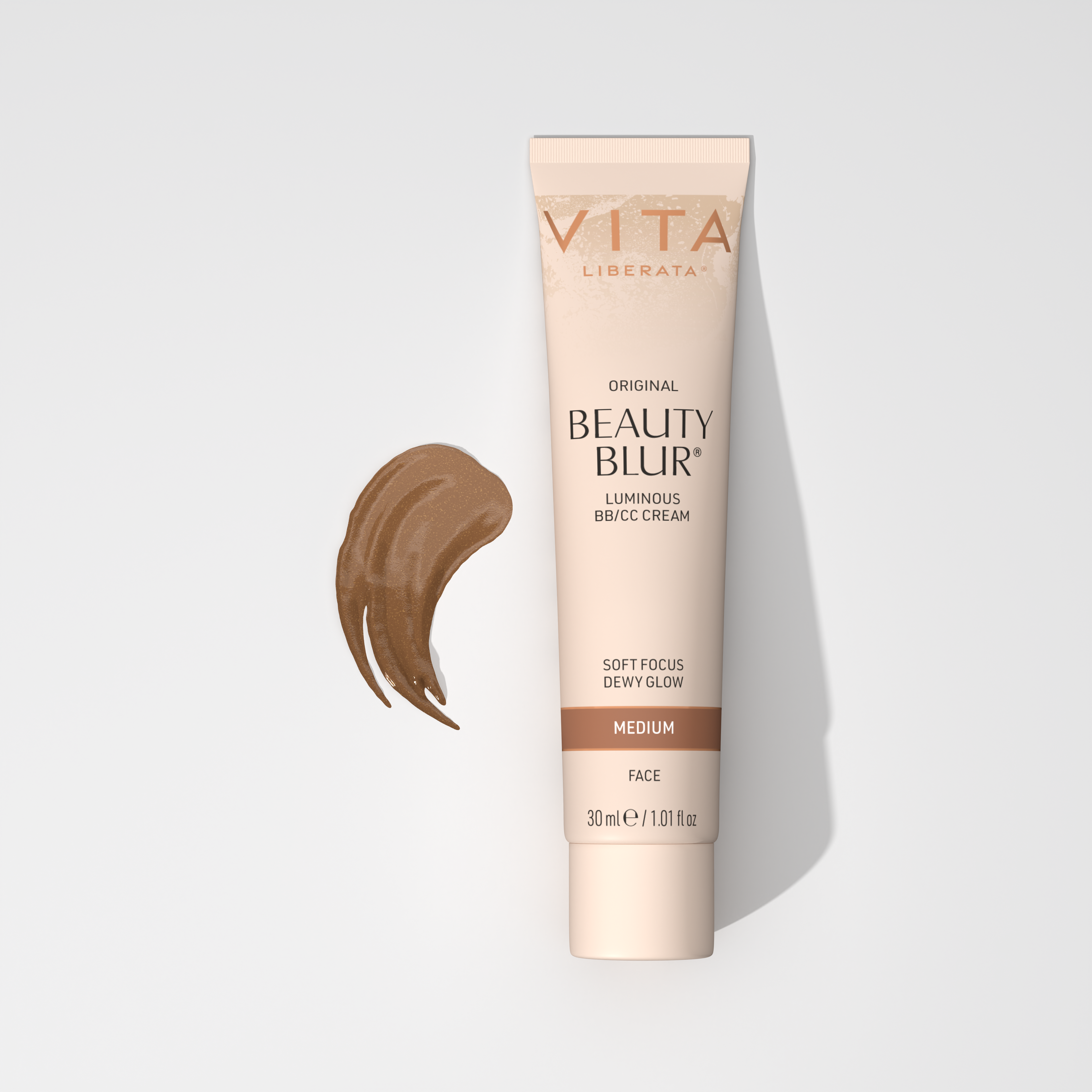 A tube of Vita Liberata Original Beauty Blur Luminous BB/CC Cream in medium shade with a swatch of the cream color next to it.