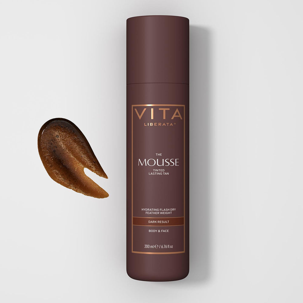 Vita Liberata mousse bottle with a sample on a light gray background