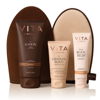 Vita Liberata tanning products including lotion, gradual build, and body blur with a brown pouch on a white background.