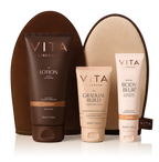 Vita Liberata tanning products including lotion, gradual build, and body blur with a brown pouch on a white background.