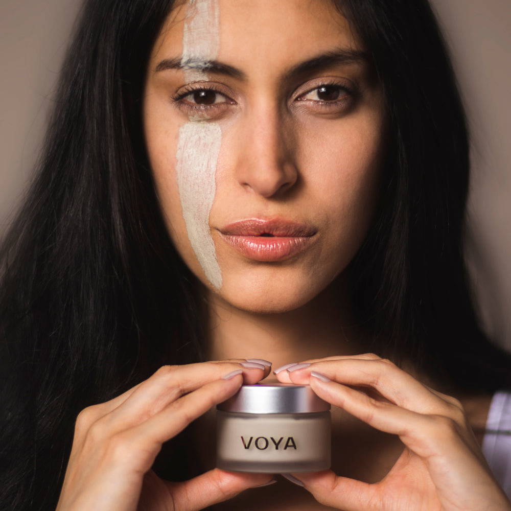 Woman using Get Glowing VOYA mask