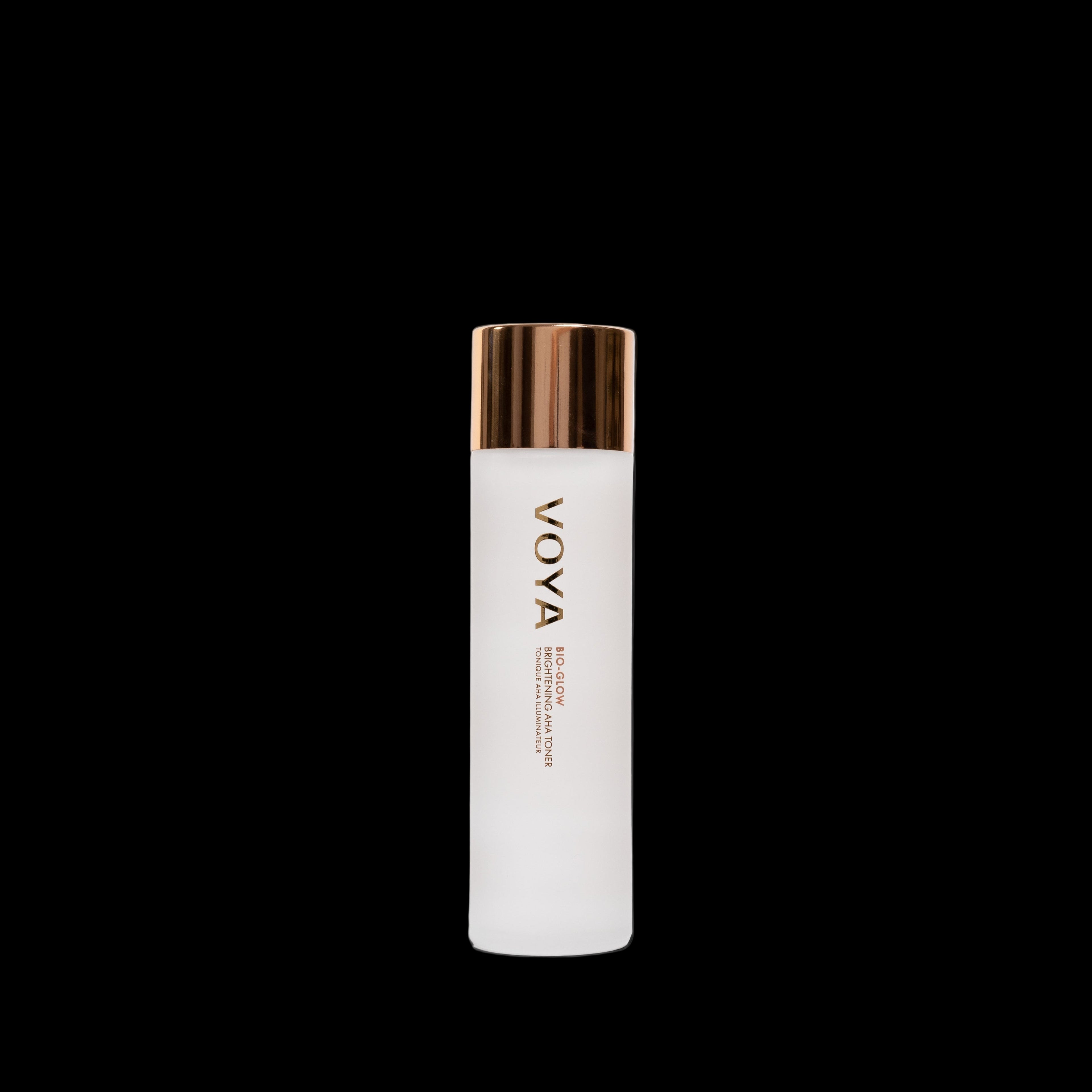 Voya Bio-Glow skincare bottle with white container and rose gold cap on a light gray background
