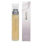 A packaged VOYA Maskerade Gel Face Mask product, with a clear tube showing the light gel texture of the mask inside, placed next to its white and silver packaging box.