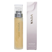 A packaged VOYA Maskerade Gel Face Mask product, with a clear tube showing the light gel texture of the mask inside, placed next to its white and silver packaging box.