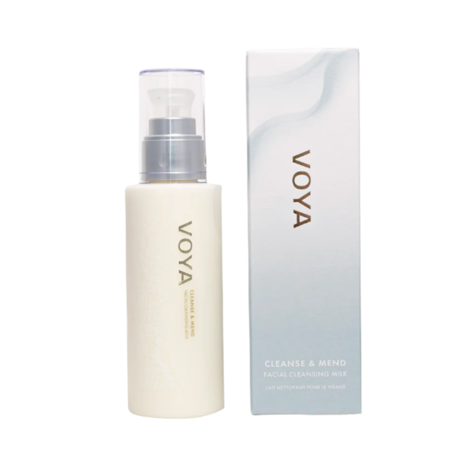 A pump bottle of VOYA facial cleansing milk next to its packaging box.