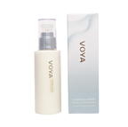 A pump bottle of VOYA facial cleansing milk next to its packaging box.