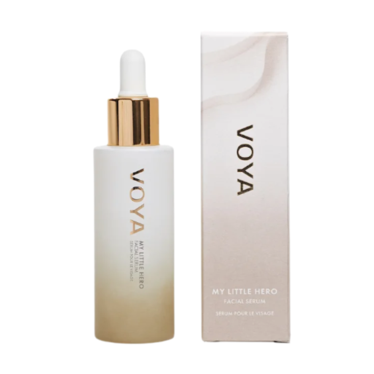 A VOYA My Little Hero bottle with a white label and a gold dropper containing facial serum, alongside its packaging box.