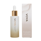 A VOYA My Little Hero bottle with a white label and a gold dropper containing facial serum, alongside its packaging box.