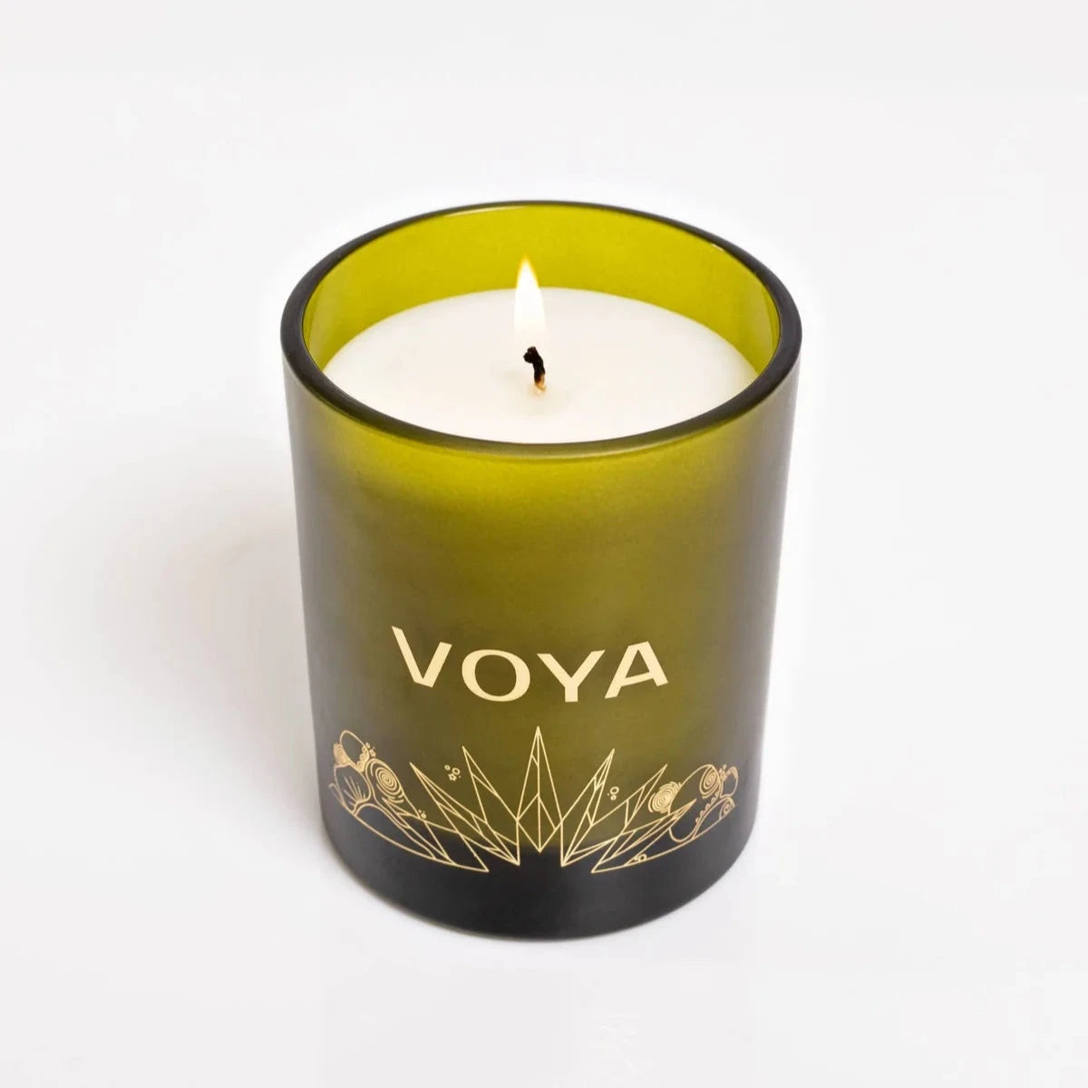 VOYA The Land of Light Christmas candle  in a green glass container on a white background