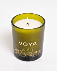 VOYA The Land of Light Christmas candle  in a green glass container on a white background
