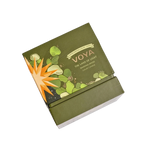 Green VOYA The Land of Light Christmas candle box with 'Voya' branding on a white background