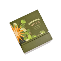 Green VOYA The Land of Light Christmas candle box with 'Voya' branding on a white background