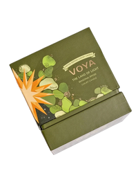 Green VOYA The Land of Light Christmas candle box with 'Voya' branding on a white background