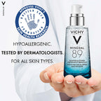 Vichy Minéral 89 bottle held in a hand with branding and text on a white background
