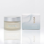 Voya Hydra Veil Hydrating Face Mask in glass jar with lid next to its box, a drink of water for the skin