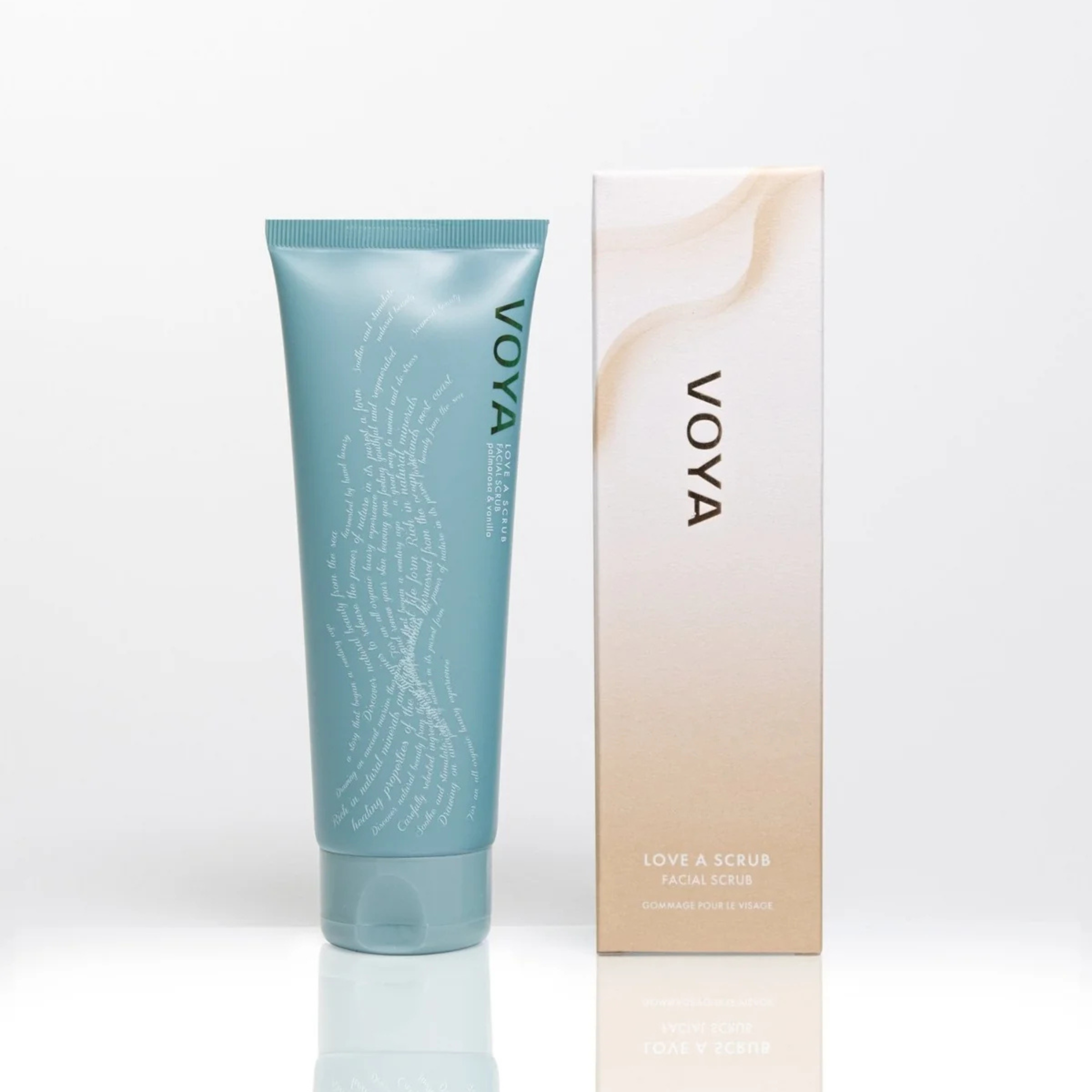 Voya Love A Scrub Facial Scrub in blue tube packaging standing next to its box