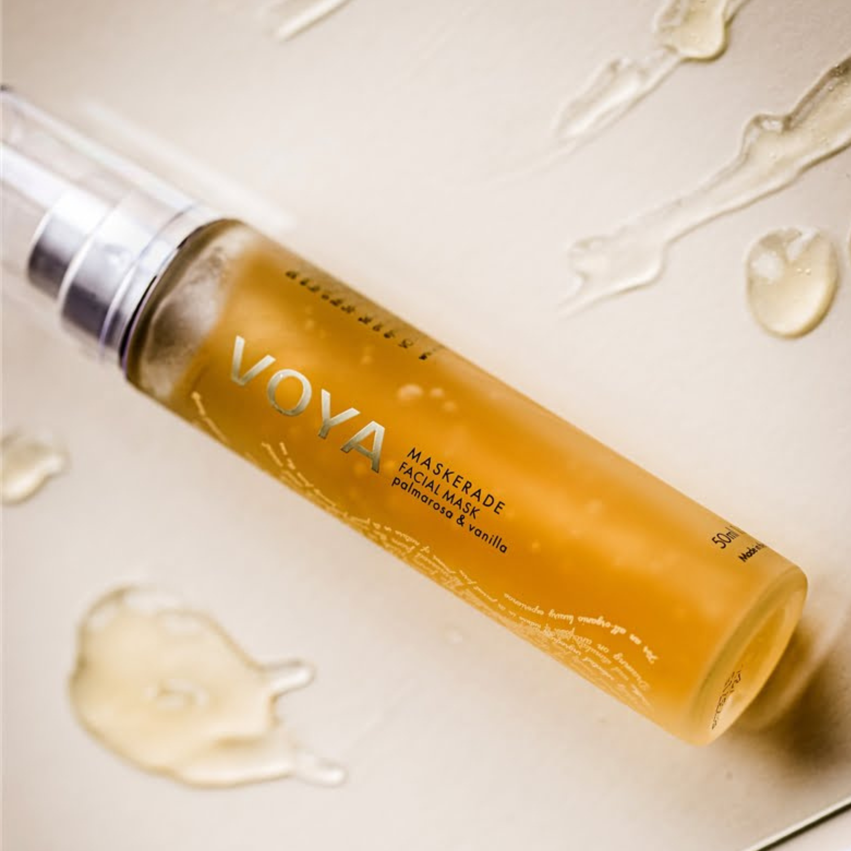 Voya Maskerade Soothing Facial Mask in glass pump bottle with clear lid, hydrating, tightening and brightening